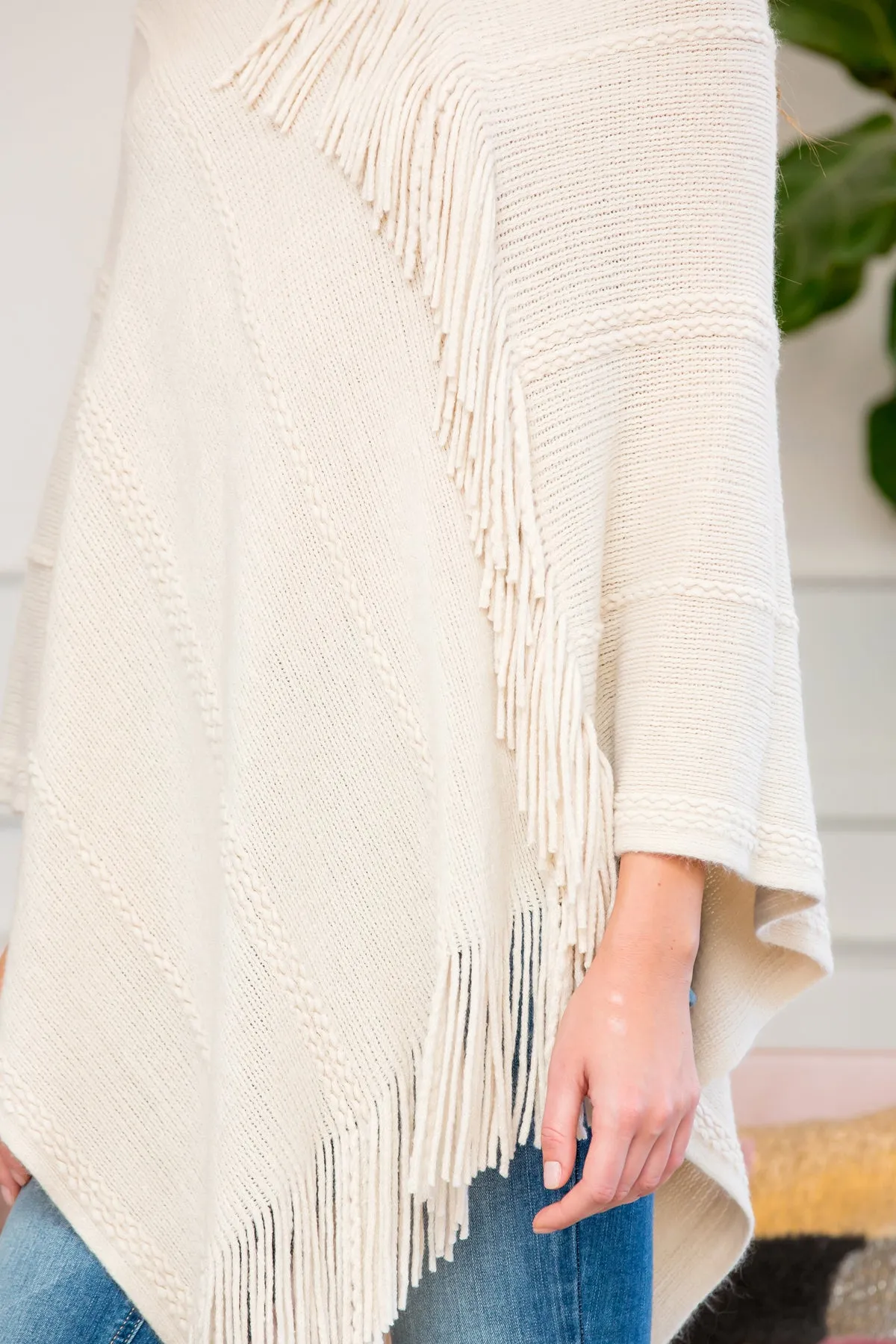 ASYMMETRIC FRINGE PONCHO